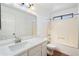 Functional bathroom featuring a single sink vanity, a large mirror, and a shower-tub combination at 2051 W Ronald Rd, Phoenix, AZ 85029