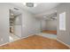 Elegant dining room featuring wood flooring and seamless transition to the adjoining kitchen area at 2051 W Ronald Rd, Phoenix, AZ 85029