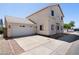 Charming two-story home featuring an attached two-car garage and a concrete driveway at 2051 W Ronald Rd, Phoenix, AZ 85029