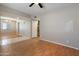 Open floor plan with living room, ceiling fan, and tile entry to the home at 2051 W Ronald Rd, Phoenix, AZ 85029