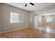 Bright living room with wood floors and entry to the home's front door at 2051 W Ronald Rd, Phoenix, AZ 85029