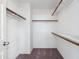 Walk-in closet with multiple shelves and carpet flooring at 2051 W Ronald Rd, Phoenix, AZ 85029