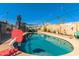 Inviting backyard swimming pool with a diving board and a basketball hoop at 2328 W Echo Ln, Phoenix, AZ 85021