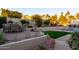 This backyard shows a charming outdoor space, complete with a refreshing pool and inviting seating at 2548 E Vermont Ave, Phoenix, AZ 85016