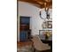 Dining area with a built-in bar, wine cooler, chandelier, and tiled floors at 2548 E Vermont Ave, Phoenix, AZ 85016