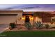 Beautiful front exterior of a home with manicured landscaping, desert plants, and warm lighting at 2548 E Vermont Ave, Phoenix, AZ 85016