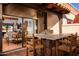 Inviting outdoor patio with a built-in grill, bar seating, and seamless access to indoor living spaces at 2548 E Vermont Ave, Phoenix, AZ 85016