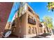 Wide angle exterior view of a two-story home highlighting balconies, arched windows, and desert landscaping at 2789 S Balsam Dr, Gilbert, AZ 85295