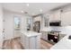 Bright kitchen featuring stainless steel appliances, white cabinets, and a center island with quartz countertops at 2789 S Balsam Dr, Gilbert, AZ 85295