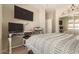 This bedroom also features a desk area with an additional monitor at 2992 N Miller Rd # 219B, Scottsdale, AZ 85251