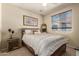 Comfortable bedroom with queen sized bed and neutral decor at 2992 N Miller Rd # 219B, Scottsdale, AZ 85251