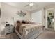 Cozy bedroom features a king bed, neutral tones and a sliding glass door at 2992 N Miller Rd # 219B, Scottsdale, AZ 85251
