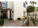 Well-maintained exterior showcasing stucco facade, tile roof, and charming desert landscaping at 2992 N Miller Rd # 219B, Scottsdale, AZ 85251