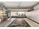 Spacious garage with ample storage cabinets and shelving for organization, plus exterior parking at 2992 N Miller Rd # 219B, Scottsdale, AZ 85251