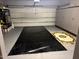 Spacious garage featuring ample storage cabinets, neutral paint, and an organized shelving unit at 2992 N Miller Rd # 219B, Scottsdale, AZ 85251