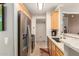 Well-lit kitchen featuring stainless steel appliances, stylish countertops, and ample cabinet space at 2992 N Miller Rd # 219B, Scottsdale, AZ 85251