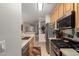 Kitchen with stainless appliances and view to dining area at 2992 N Miller Rd # 219B, Scottsdale, AZ 85251
