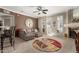 Comfortable living room with fireplace, neutral carpet, slider and stylish sectional sofa at 2992 N Miller Rd # 219B, Scottsdale, AZ 85251