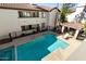 Beautiful community pool surrounded by well-maintained landscaping and lounging areas at 2992 N Miller Rd # 219B, Scottsdale, AZ 85251