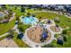 Aerial view of neighborhood splash pad, playground, park, and common areas at 30324 W Crittenden Ln, Buckeye, AZ 85396