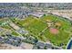 Community aerial view showcasing park amenities including sports fields and green spaces at 30324 W Crittenden Ln, Buckeye, AZ 85396