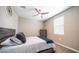 Bedroom with a large bed and a ceiling fan for added comfort and style at 30324 W Crittenden Ln, Buckeye, AZ 85396