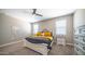 Bedroom with neutral paint, carpet, ceiling fan, and white furniture at 30324 W Crittenden Ln, Buckeye, AZ 85396