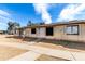 View of the exterior of a modern single-Gathering home with desert landscaping at 3120 N 67Th Ln # 96, Phoenix, AZ 85033