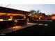 Outdoor oasis with a bar, fire pit, and ample seating for entertainment in backyard at 31626 N 129Th Dr, Peoria, AZ 85383