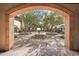 Elegant courtyard featuring a central fountain, manicured greenery, and arched entrances at 31626 N 129Th Dr, Peoria, AZ 85383