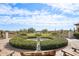 Picturesque water fountain, lush green landscaping, and scenic views of the surrounding area at 31626 N 129Th Dr, Peoria, AZ 85383