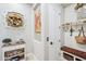 Inviting hallway with decorative accents and a view into the mudroom at 31626 N 129Th Dr, Peoria, AZ 85383