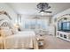 Spacious main bedroom featuring a ceiling fan, plenty of natural light, and neutral décor at 31626 N 129Th Dr, Peoria, AZ 85383