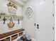 Cozy mudroom with a cushioned bench, storage baskets, and charming decor at 31626 N 129Th Dr, Peoria, AZ 85383