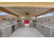 This covered outdoor kitchen has stone countertops, stainless steel appliances and offers plenty of counter space for food prep at 31626 N 129Th Dr, Peoria, AZ 85383