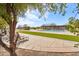 Community pool featuring a covered seating area, playground, and lounge chairs for relaxation and enjoyment at 31626 N 129Th Dr, Peoria, AZ 85383