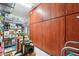 Storage room featuring a set of built-in wooden cabinets and open space for boxes at 31626 N 129Th Dr, Peoria, AZ 85383