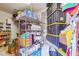 Organized storage room with shelves filled with neatly arranged boxes and storage containers at 31626 N 129Th Dr, Peoria, AZ 85383