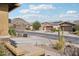 Street view of well-maintained homes in a quiet neighborhood with desert landscaping at 31626 N 129Th Dr, Peoria, AZ 85383