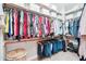 Walk-in closet with custom shelves and rods, providing ample storage space for clothes at 31626 N 129Th Dr, Peoria, AZ 85383
