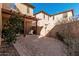 Private backyard showcasing a cozy pergola, brick-paved patio, and low-maintenance landscaping at 32405 N 23Rd Ave, Phoenix, AZ 85085