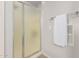 Bathroom featuring a frosted glass shower door and a towel rack with a clean, folded towel at 32405 N 23Rd Ave, Phoenix, AZ 85085