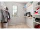 Organized walk-in closet with shelving, clothes rods, and a variety of personal items stored neatly at 32405 N 23Rd Ave, Phoenix, AZ 85085