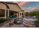 Inviting backyard with a pool, spa, and a covered patio with comfortable seating at 3318 W Ravina Ln, Anthem, AZ 85086