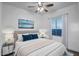 Serene bedroom with ample natural light, plush bedding, and stylish decor elements at 3318 W Ravina Ln, Anthem, AZ 85086