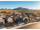 Beautiful southwest home features tile roof and desert landscaping with mountain views at 3318 W Ravina Ln, Anthem, AZ 85086