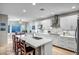 Open kitchen with a large island, modern appliances, and white cabinetry at 3318 W Ravina Ln, Anthem, AZ 85086