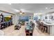 Open-concept living room with tile flooring, ceiling fan, and great natural light at 3318 W Ravina Ln, Anthem, AZ 85086