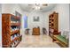 Office with shelving, desk, chair, natural lighting, and travertine flooring at 3318 W Ravina Ln, Anthem, AZ 85086