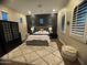 Comfortable bedroom featuring a decorative wall, soft rug, and stylish furnishings at 3370 S Ivy Way, Chandler, AZ 85248